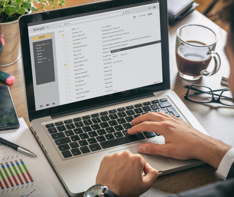 emails-list-on-a-laptop-screen-office-background.jpg